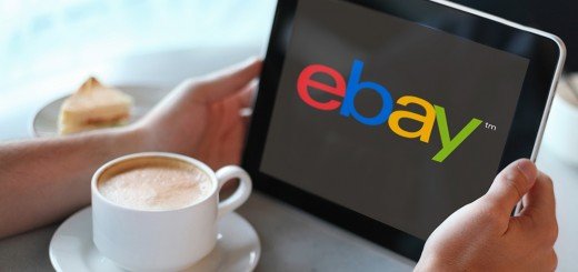 Man holding laptop or computer in cafe