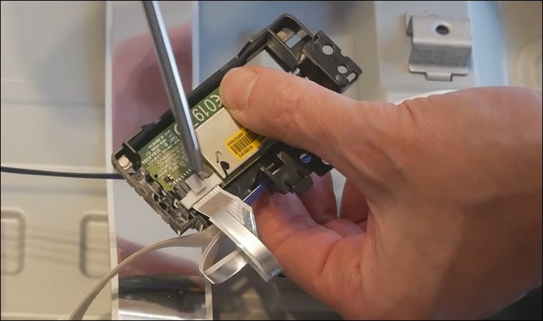 Unplug the Ribbon Cable From the WiFi Module Unplug the Ribbon Cable From the WiFi Module